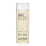 A clear bottle of Giovanni Cosmetics GOLDEN WHEAT™ DEEP CLEANSE SHAMPOO for normal to oily hair, with a white cap and front label, highlights its color-safe formula for oily hair. Available in 2 sizes.