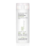 A bottle of Giovanni TEA TREE TRIPLE TREAT INVIGORATING CONDITIONER for hair care.