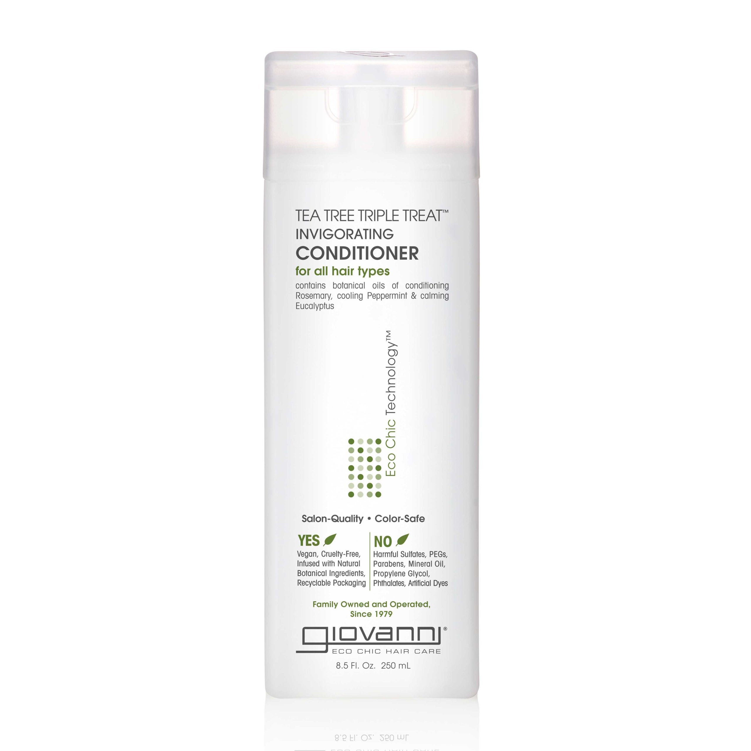 TEA TREE CONDITIONER FOR ALL HAIR TYPES - A bottle of Giovanni TEA TREE TRIPLE TREAT INVIGORATING CONDITIONER for hair care.