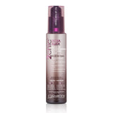 A bottle of Giovanni Cosmetics 2chic® ULTRA-SLEEK LEAVE-IN CONDITIONING & STYLING ELIXIR, enriched with Brazilian Keratin and Moroccan Argan Oil for all hair types, comes in a pink and white pump bottle.