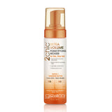 A white bottle of Giovanni Cosmetics 2chic® ULTRA-VOLUME FOAM STYLING MOUSSE, color-safe and ideal for fine, limp hair, with orange accents and a pump dispenser.