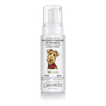 A white bottle of Giovanni Cosmetics PROFESSIONAL WATERLESS FOAMING PET SHAMPOO - OATMEAL & COCONUT features a cartoon dog, pump dispenser, 16 pet benefits, and no rinsing needed—ideal for sensitive skin.