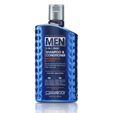 A blue bottle of Giovanni Cosmetics MEN 2-in-1 Daily Shampoo & Conditioner with Ginseng & Eucalyptus, a men’s hair cleanser, features textured sides and white text on the label.