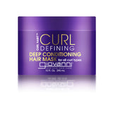 A purple container labeled CURL HABIT™ CURL DEFINING DEEP CONDITIONING HAIR MASK by Giovanni Cosmetics, 10 fl. oz. (295 mL), features white and yellow text and moisturizing oils to hydrate all curl types.