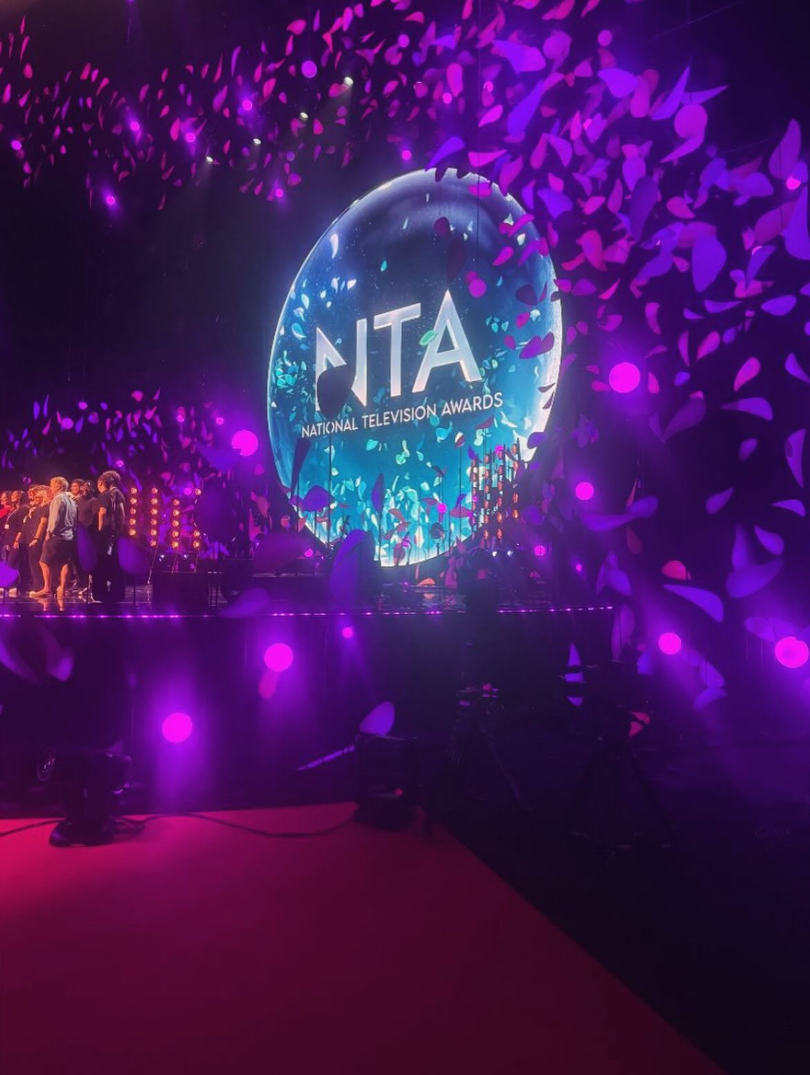 Stage with 'NITA' logo at the National Television Awards, surrounded by confetti.