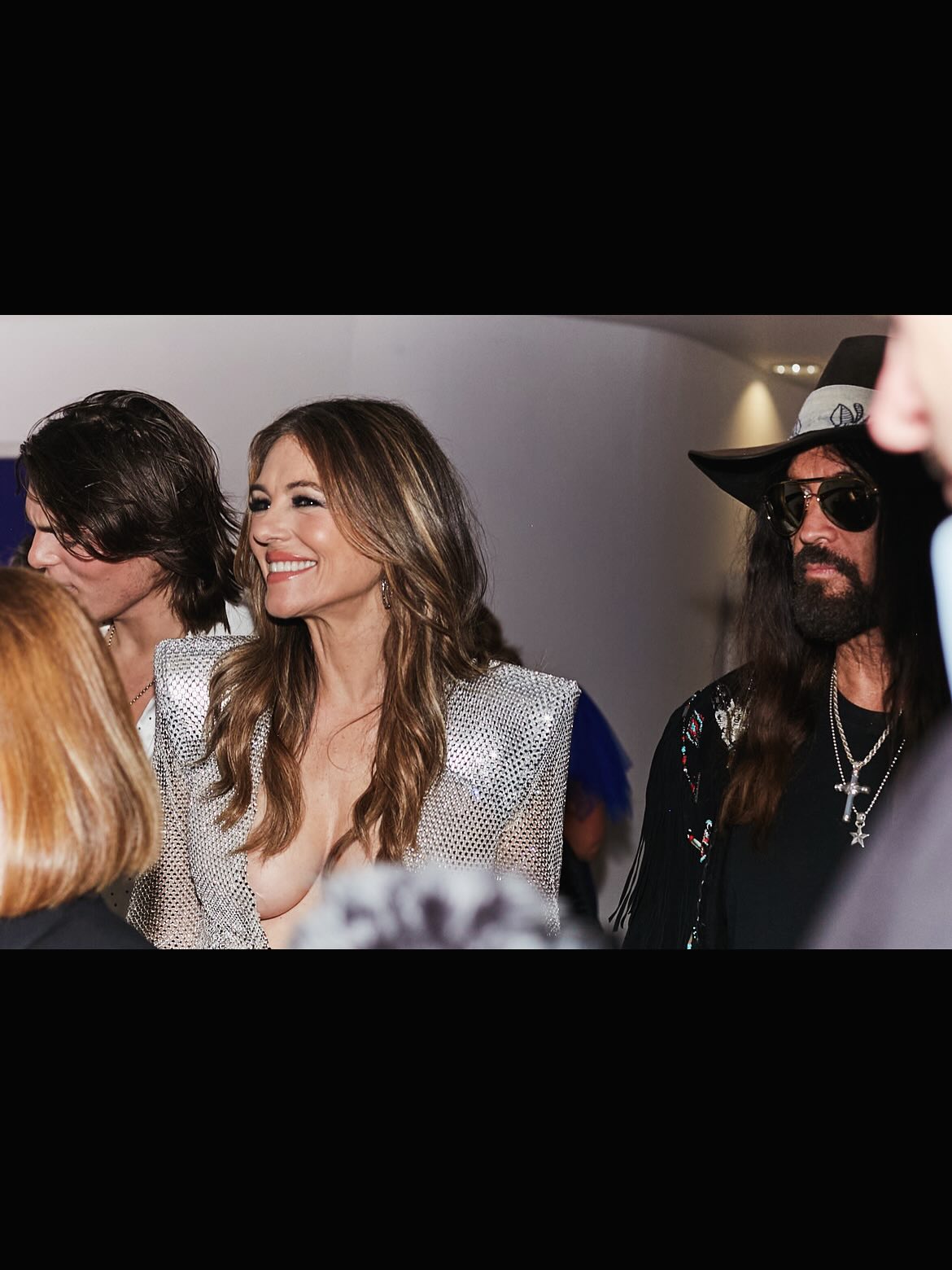 Woman in a silver outfit smiling at National Television Awards