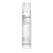 A bottle of Giovanni hair texturizing spray with white and silver label, designed for hairstyling and finishing.